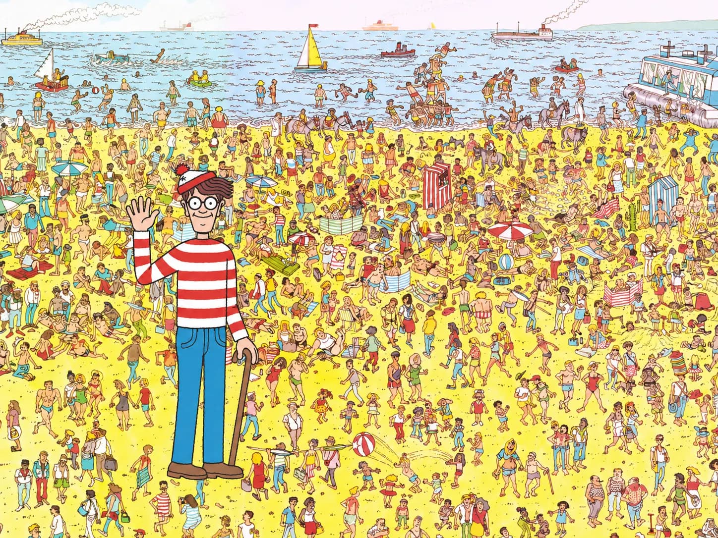 Wally clearly visible in front of a busy beach scene